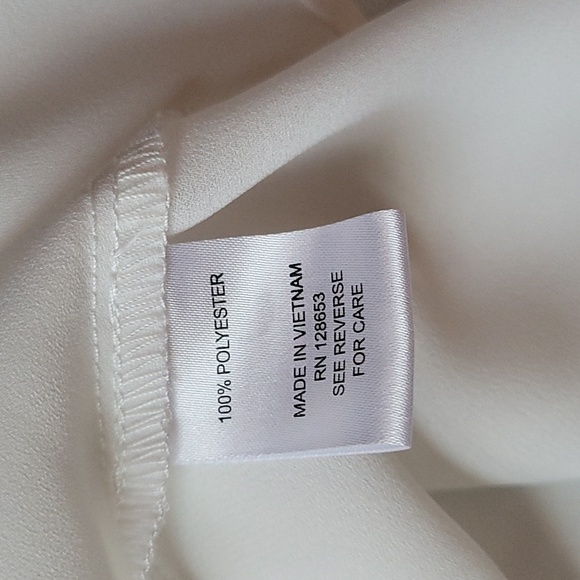 Long sleeved white collar, button down ruffled blouse w/black attached tie. - Picture 5 of 5